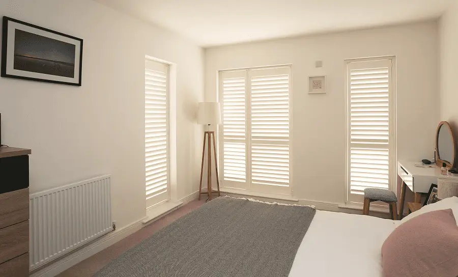 White plantation shutters on a five-sided lounge bay in Pontefract