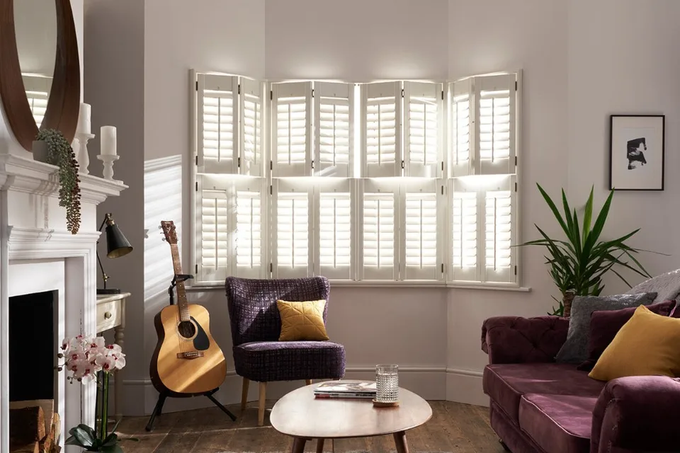 Antigua shutters fitted in a bright living room.