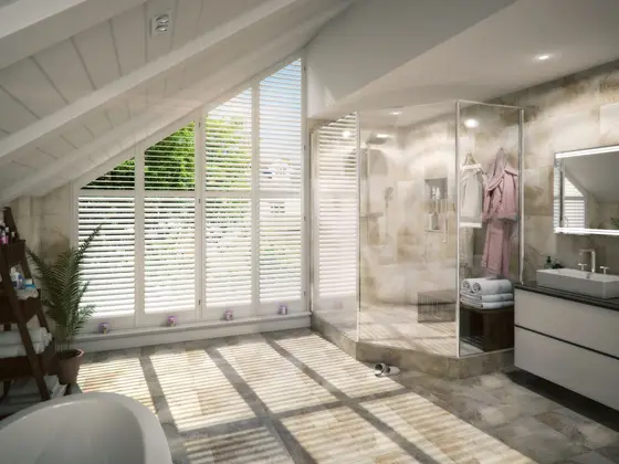 Angled white Java shutters in a vaulted bathroom next to a walk-in shower.