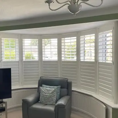 Bay window plantation shutters in a Haxby Village home