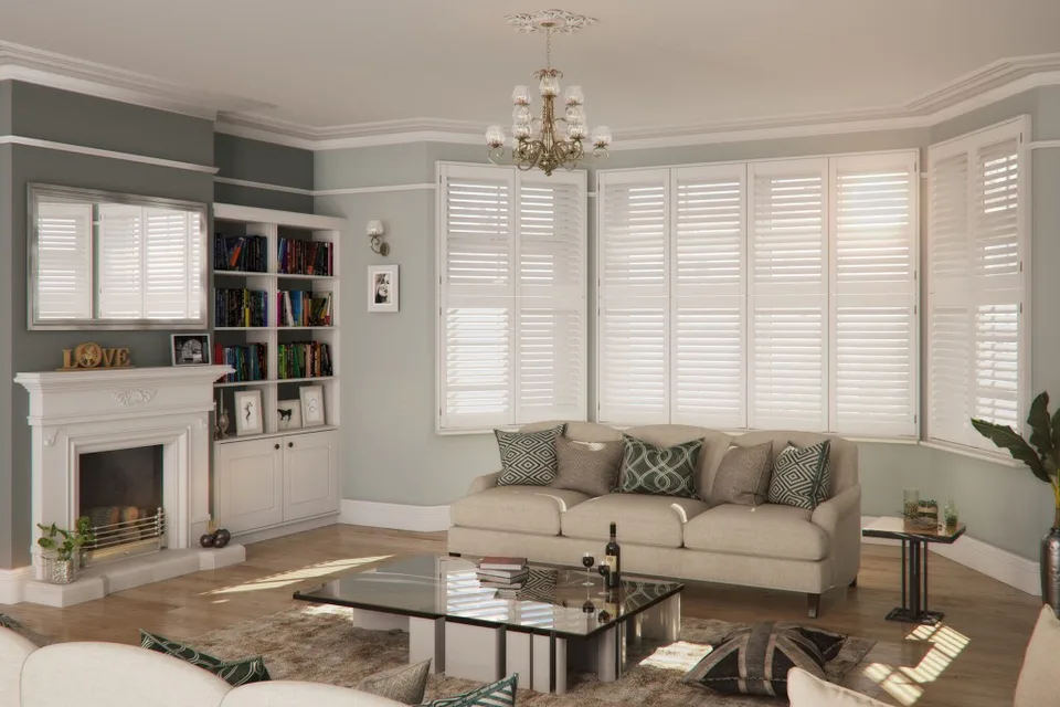 Bay window shutters installed in a lounge.