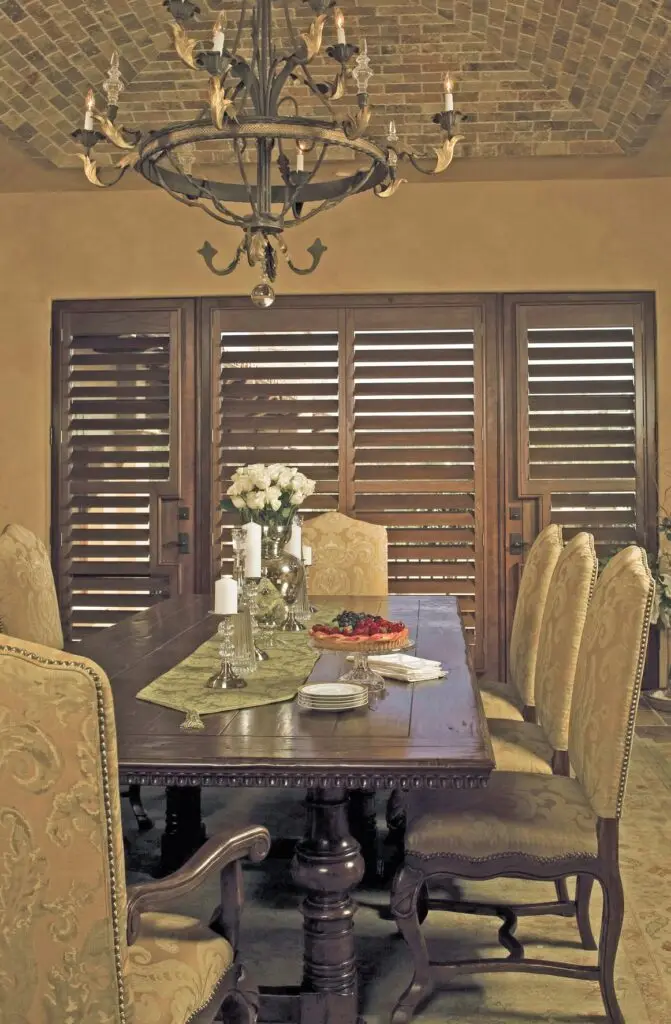 Full height plantation shutters in a Huddersfield stone cottage room