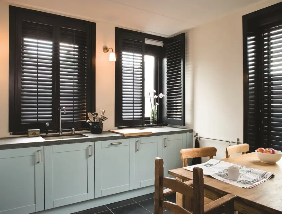 Full-height plantation shutters in a Golcar stone lounge