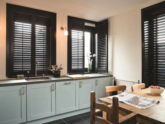 Full height shutters spanning an entire window.