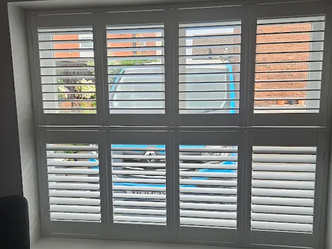 Customer photo of fitted plantation shutters from Kathleen Mosby’s Google review