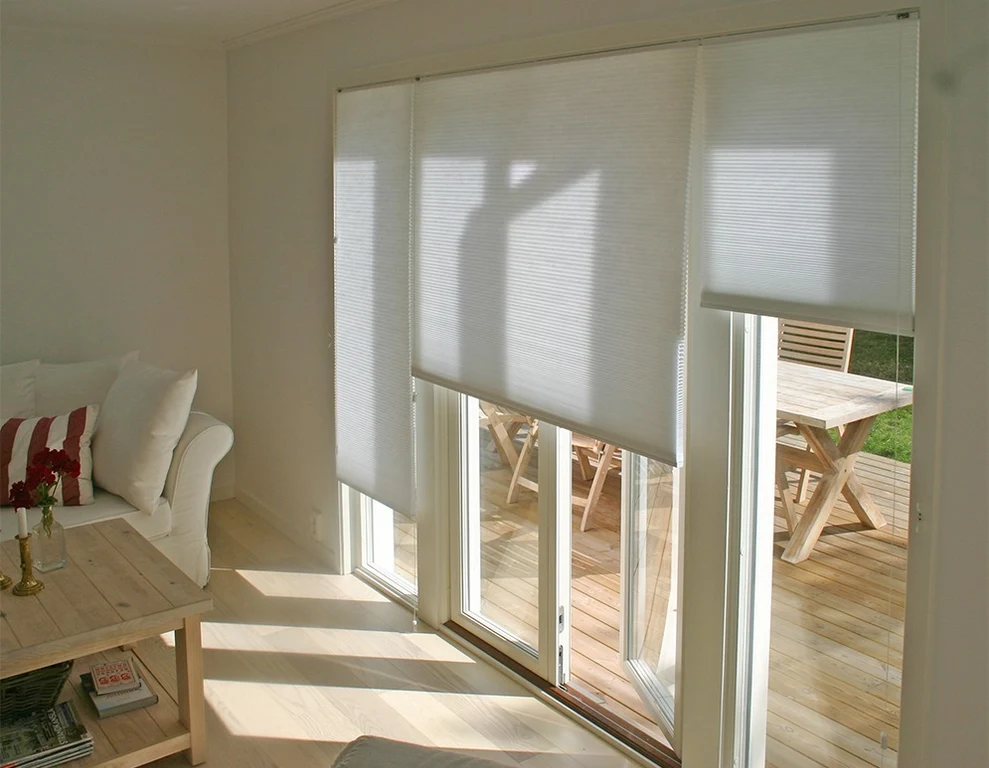 Parma honeycomb blinds installed across glazed patio doors.