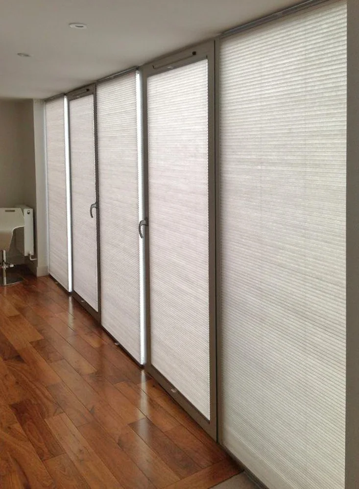 Parma honeycomb blinds on sliding doors in a Huddersfield home.