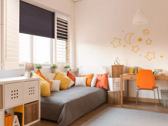 Shutter and shade combination in a bedroom.