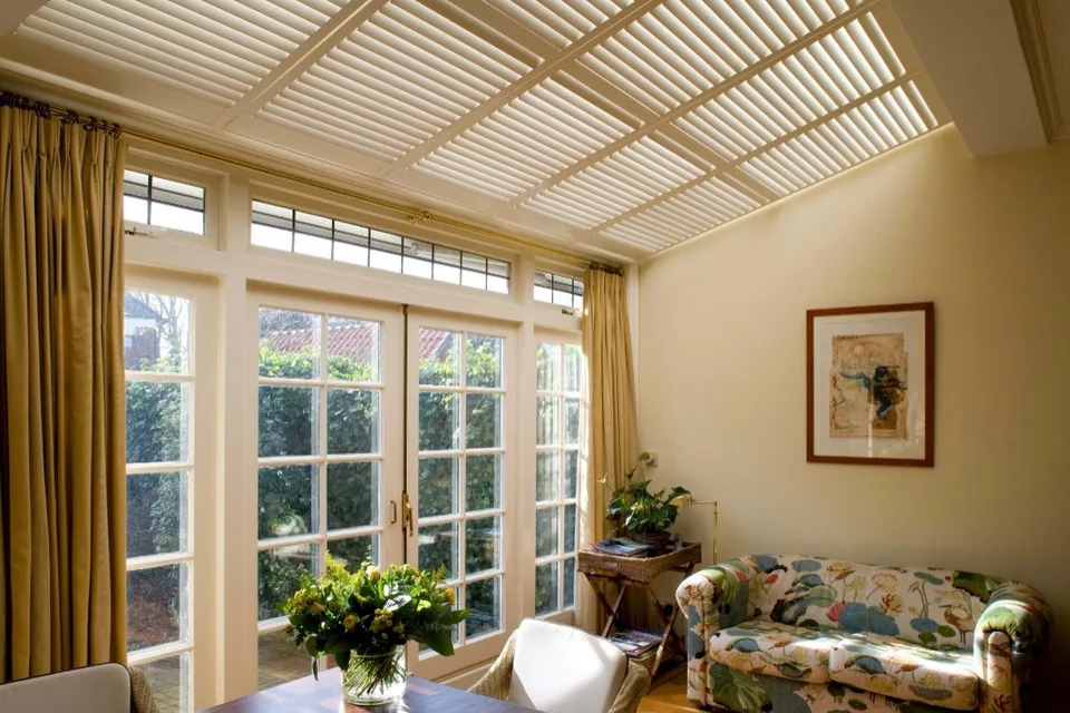 Honeycomb blind style shown in a bright glazed living area.