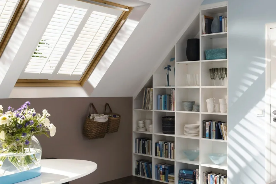 Skylight shutters fitted on a sloped roof window.