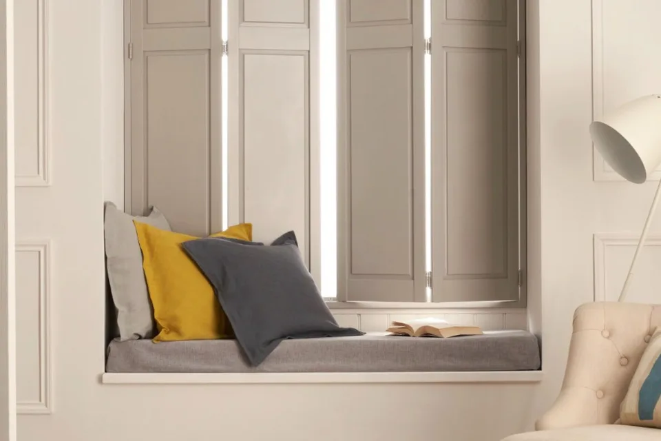 Solid panel shutters in a cosy interior.