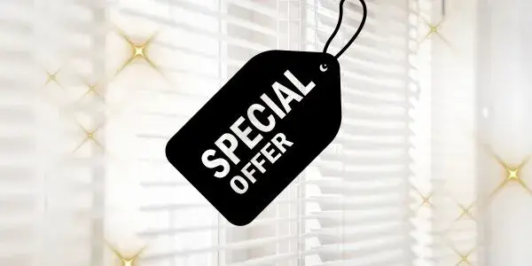 Special offer tag over bright window blinds with soft sparkles.