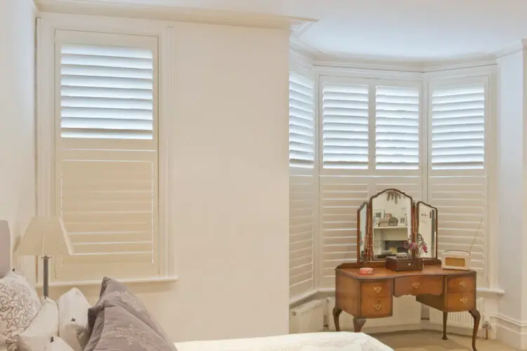Curved bay plantation shutters on a Pudsey stone house