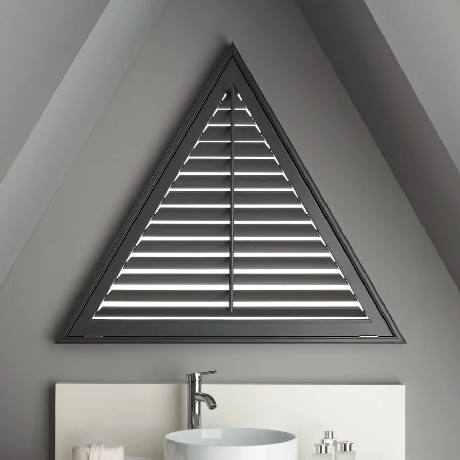 Dark framed triangular shaped shutter in a contemporary bathroom.