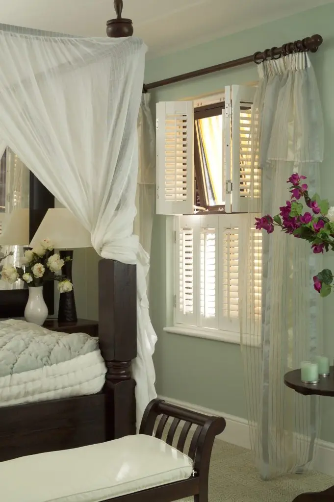 Plantation shutters framing daylight in a Bradford stone-built home